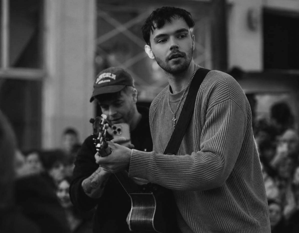 Brandon Boag performing with guitar